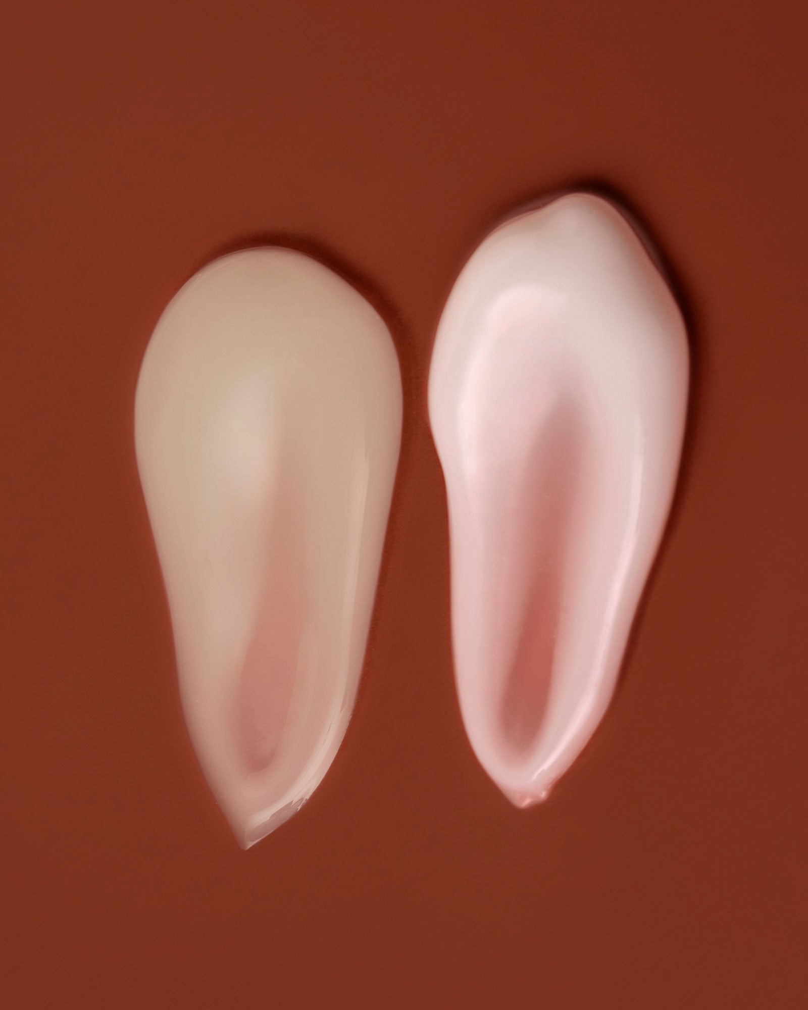 Serum and cream smear on an orange background