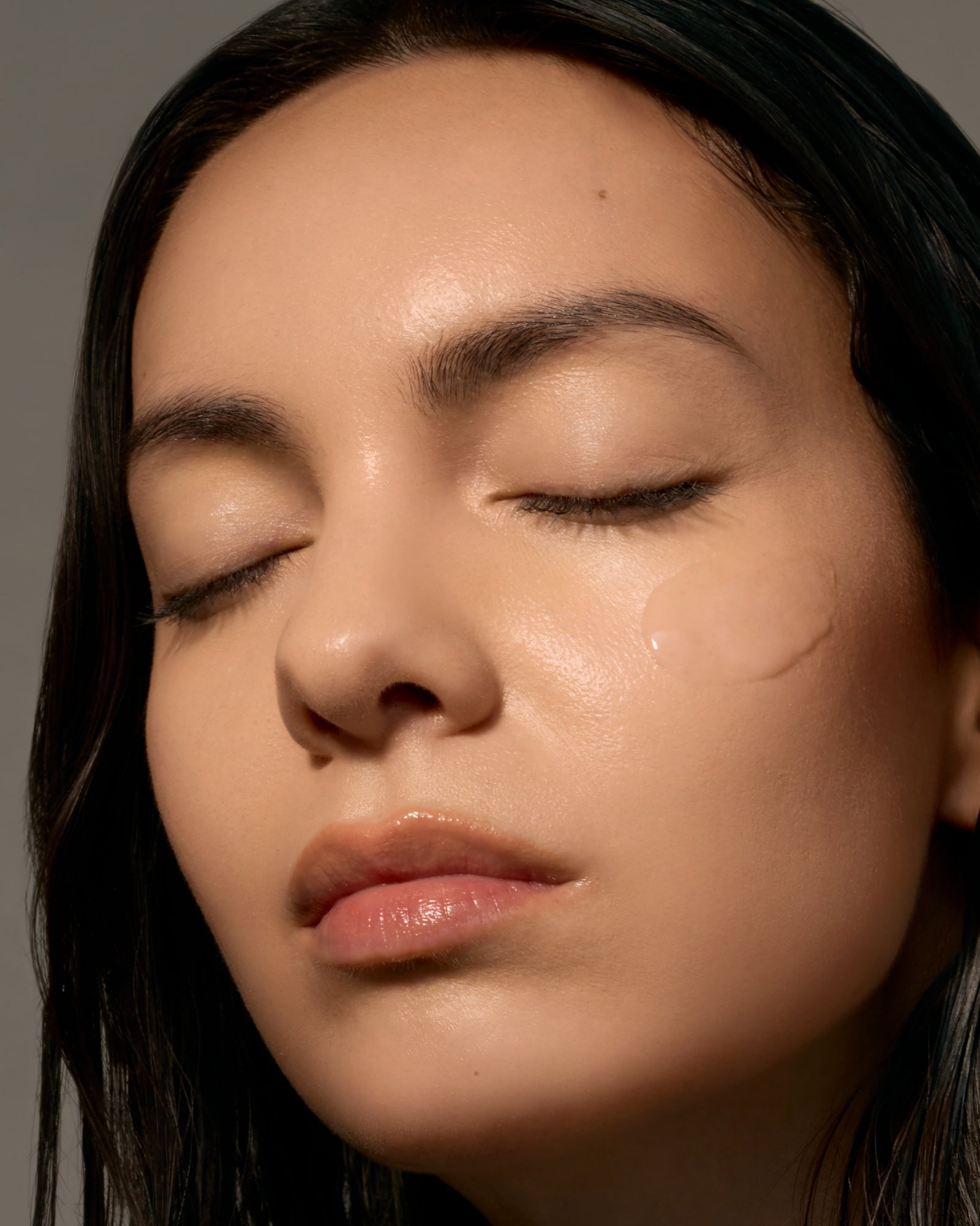 Close-up of a person with serum smear on the cheek