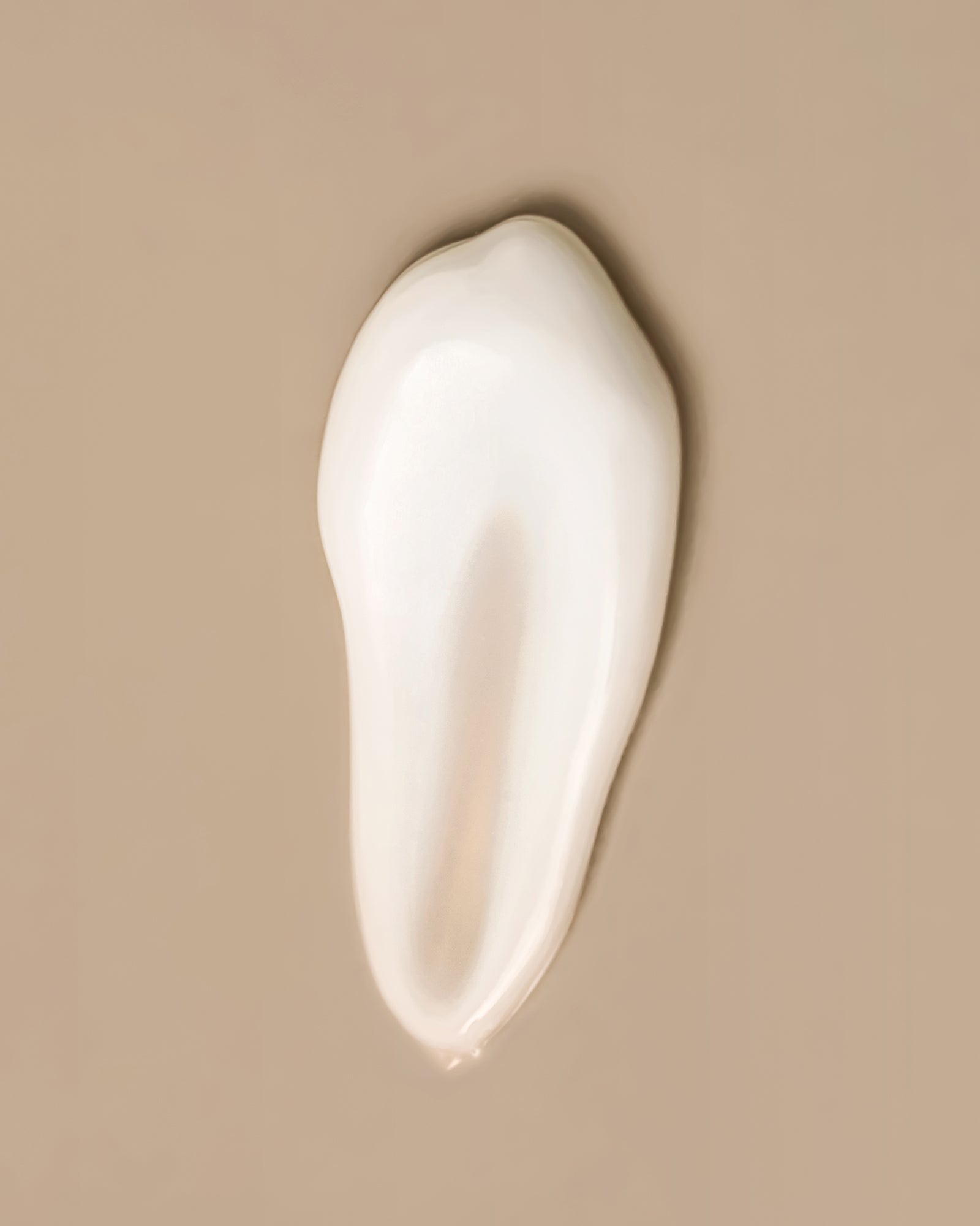 Skin care cream smear on a beige background