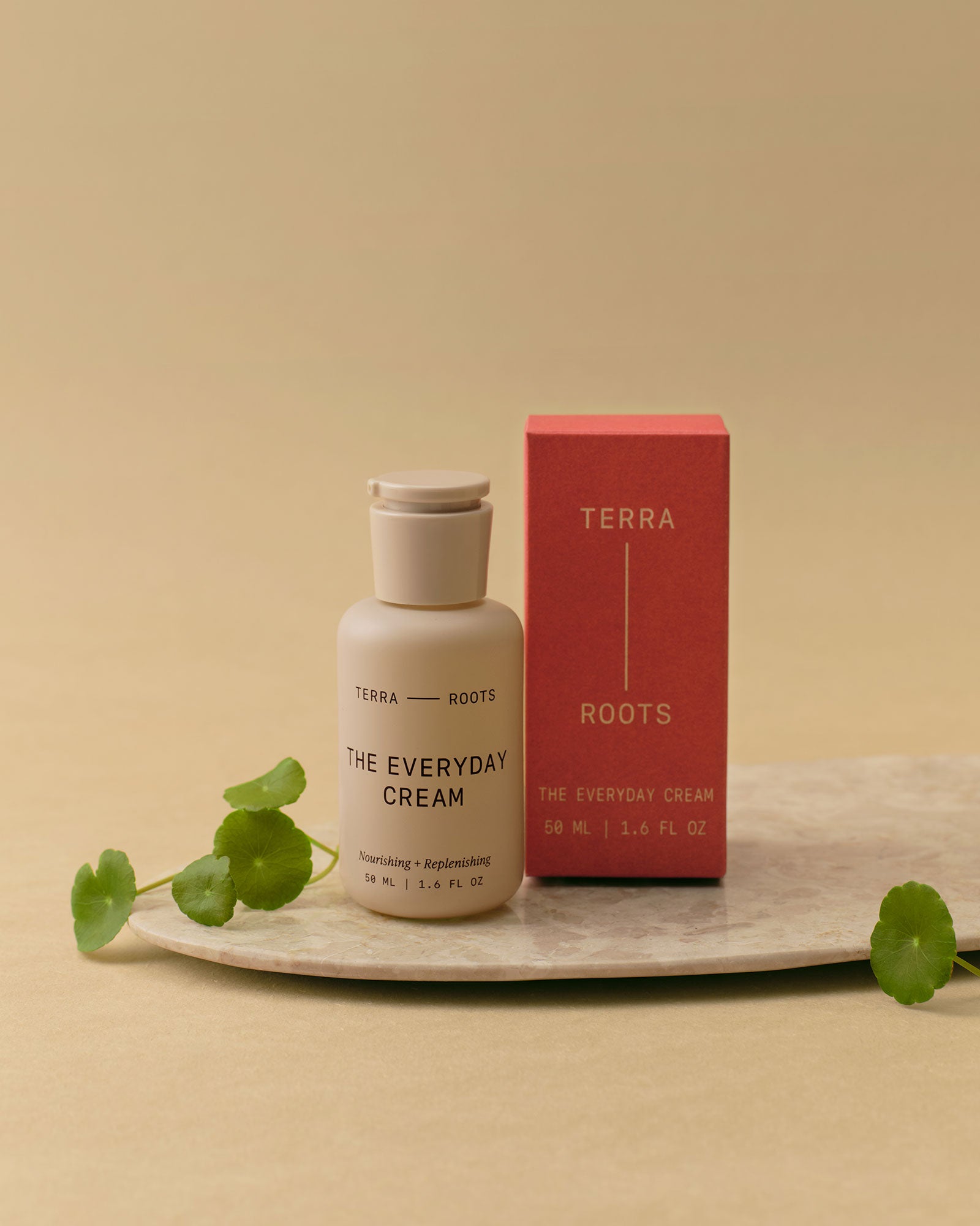 Terra Roots skincare product with bottle and box on a beige background