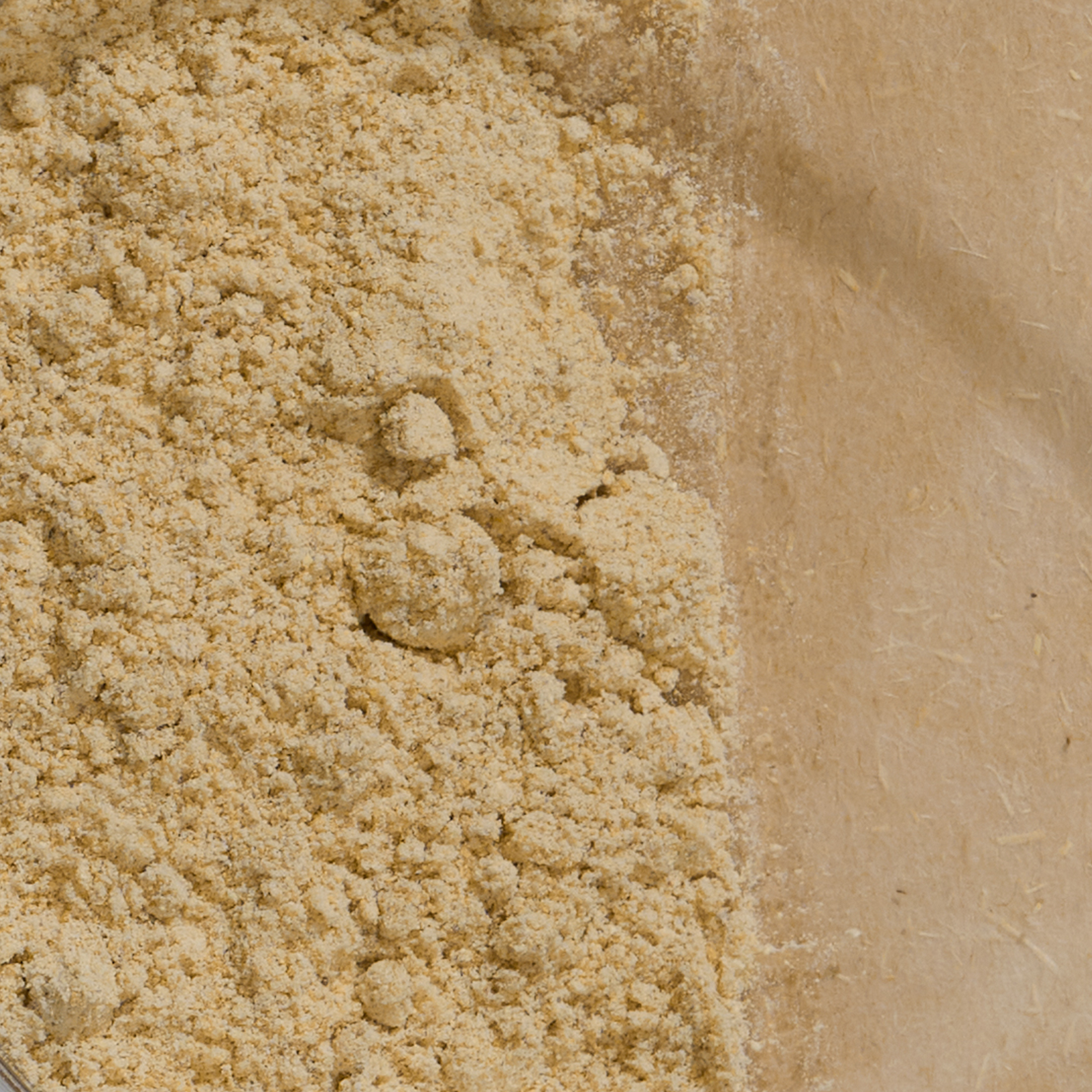 Close-up of beige sand with a textured surface